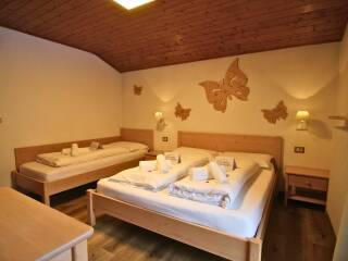 17. Catered chalet Neidia Selva Wolkenstein Driepersoonskamer